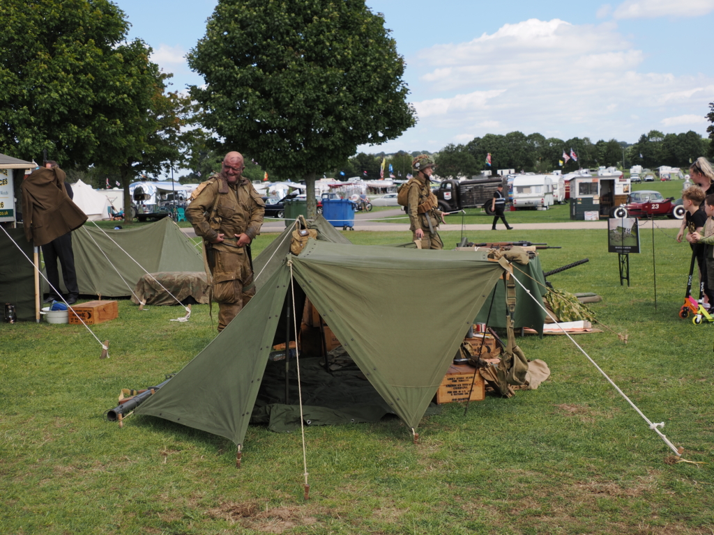 Military re-enactors with camp