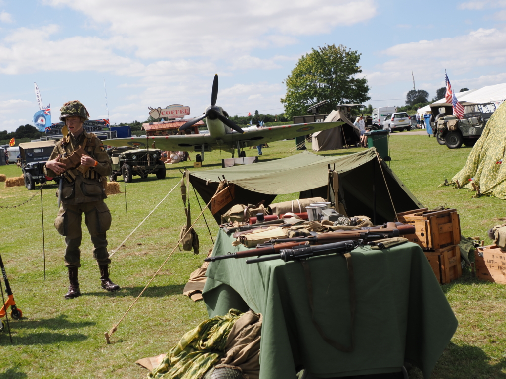 Military re-enactors with camp